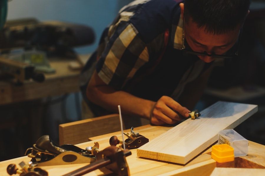 A carpenter at the bench in their workshop